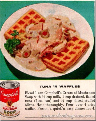 scan of (presumably) an old cookbook with recipe for TUNA 'N WAFFLES: "Blend 1 can Campbell’s Cream of Mushroom Soup with ¼ cup milk, 1 cup drained, flaked tuna (7-oz. can) and ¼ cup sliced stuffed olives. Heat thoroughly. Pour over 4 crisp waffles. Presto, a quick’n easy dinner for 4." there is a picture of the described dish, and a can of Campbell's Cream of Mushroom Soup. there is a watermark in a handwriting-style font saying "www.midcenturymenu.com"