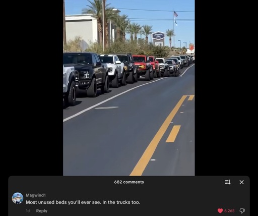A long line of pickup trucks in a TikTok video with the comments section showing. One of the top comments is “Most unused beds you'll ever see. In the trucks too.”
